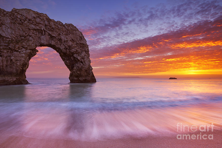 Durdle Door rock arch in Southern England at sunset Photograph by Sara ...