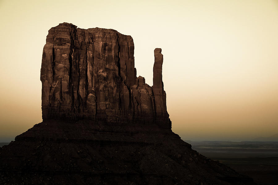 America Photograph - Dusk on the Monument Valley Mitten - Sepia by Gregory Ballos