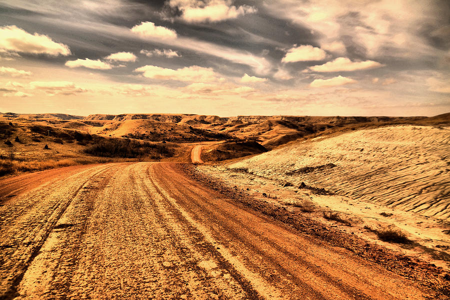 Dusty Dakota road Photograph by Jeff Swan
