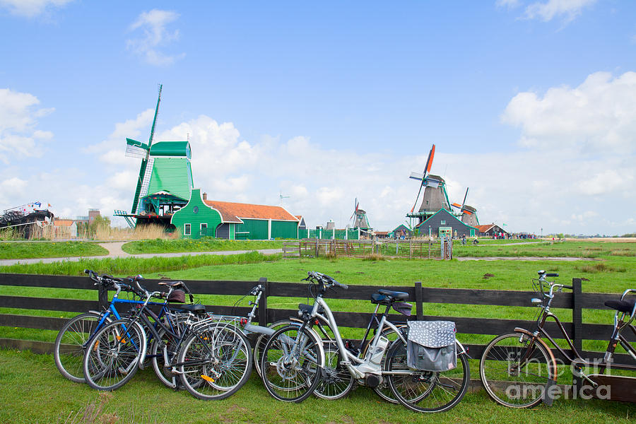 dutch windmills with bikes in Zaanse Schans Photograph by Anastasy Yarmolovich