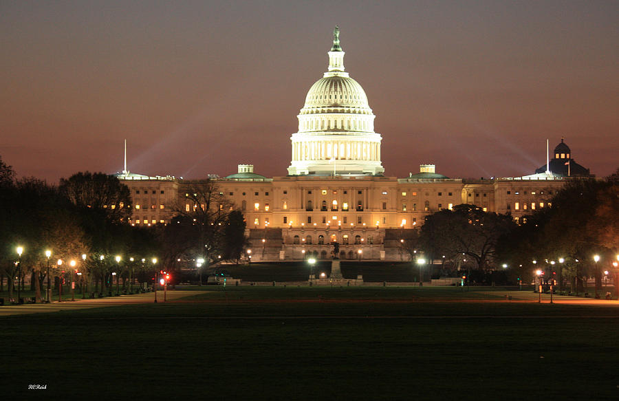 Early Washington Mornings - US Capitol in the Spotlight Photograph by Ronald Reid