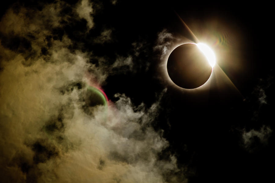 Eclipse and a rainbow Photograph by Susan Harris - Fine Art America