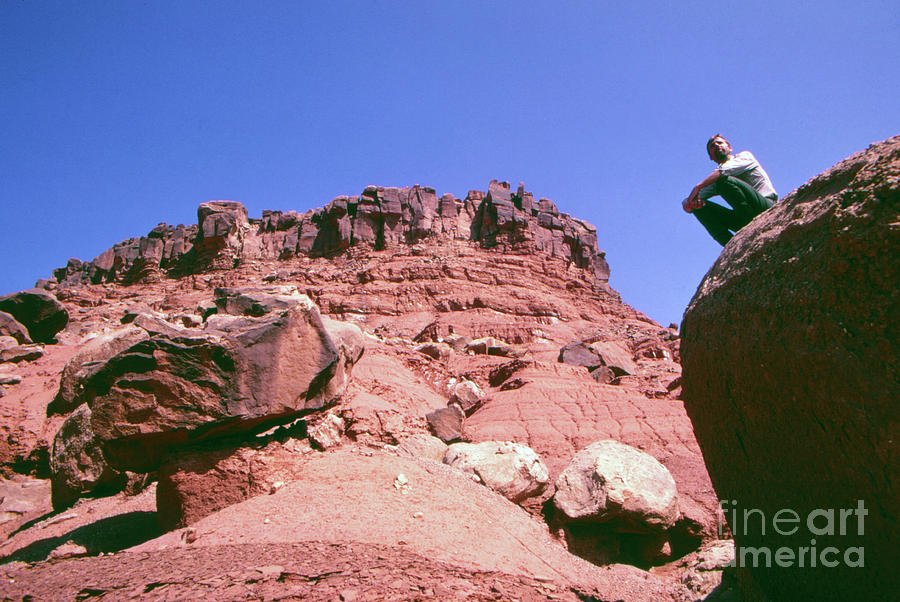 Canyonlands National Park Photograph - Edward Abbey on rocks in the desert, 1969 by The Harrington Collection