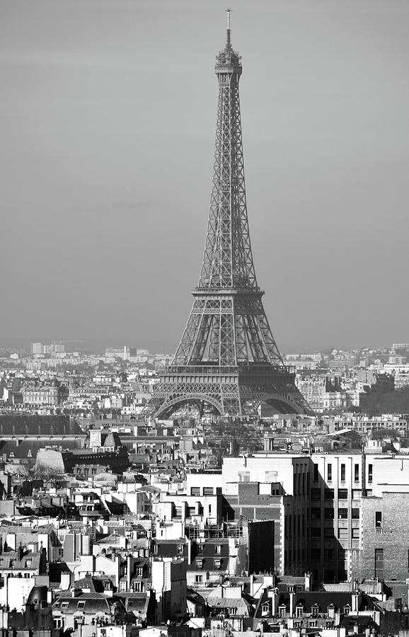 Eiffel Tower Rising Above French Rooftops Paris France Black and White Photograph by Shawn OBrien