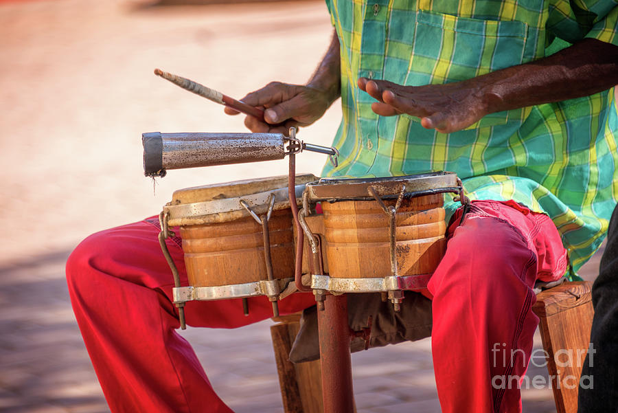 Street musician playing drums, Cuba Photograph by Delphimages Photo Creations