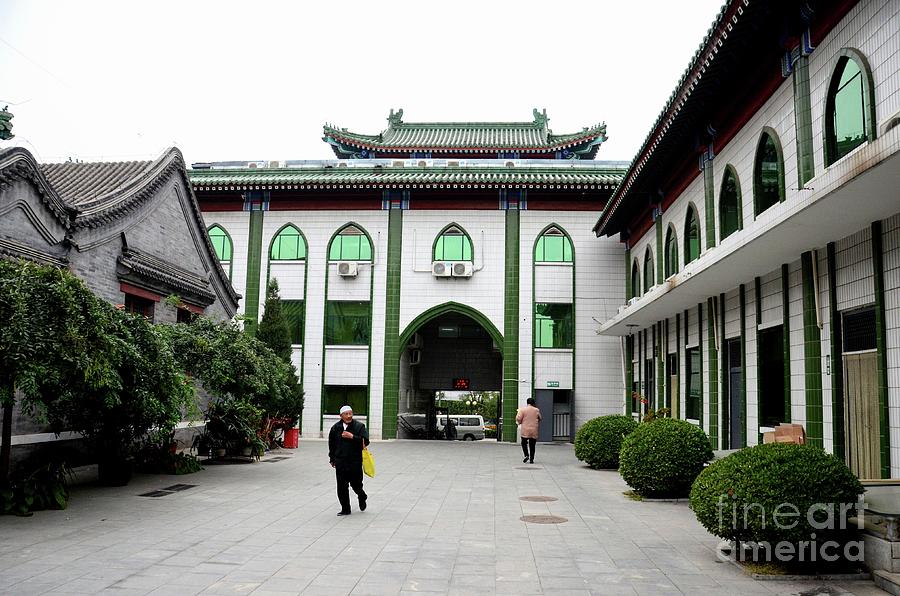 Elderly Chinese Muslim man walks in entrance courtyard of mosque Beijing China Photograph by Imran Ahmed