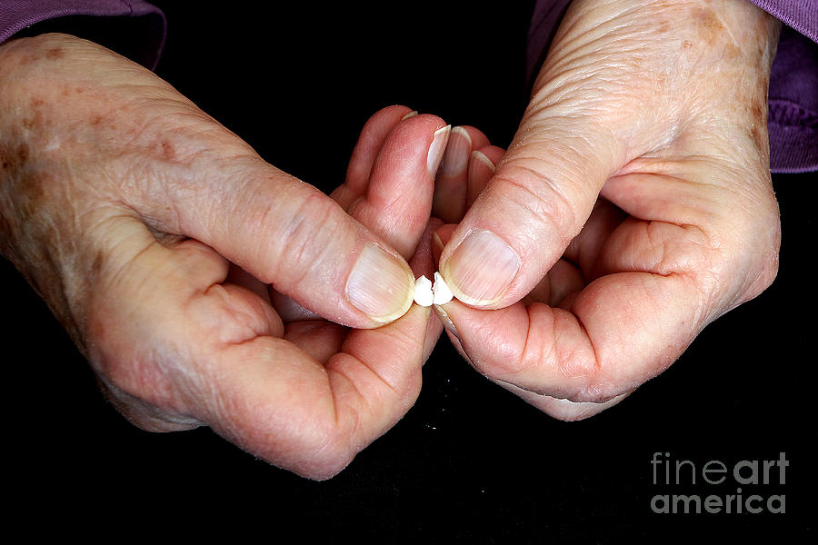 Elderly Hands Break A Pill Photograph by Scimat