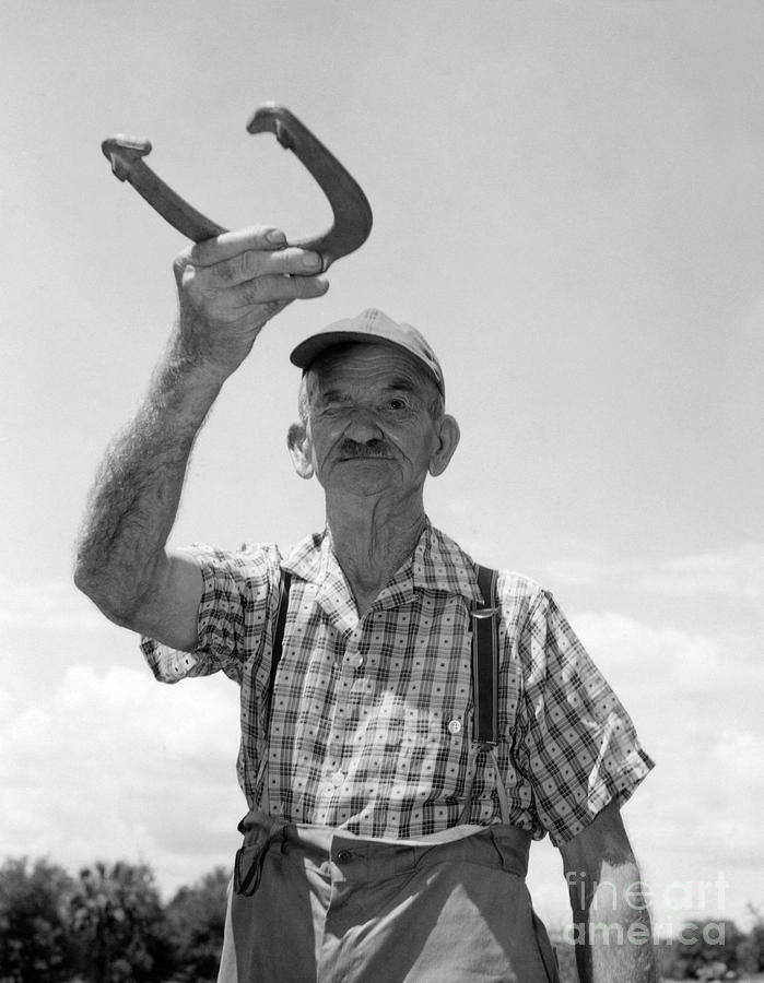Elderly Man Playing Horseshoes, C.1950s Photograph by Debrocke/ClassicStock