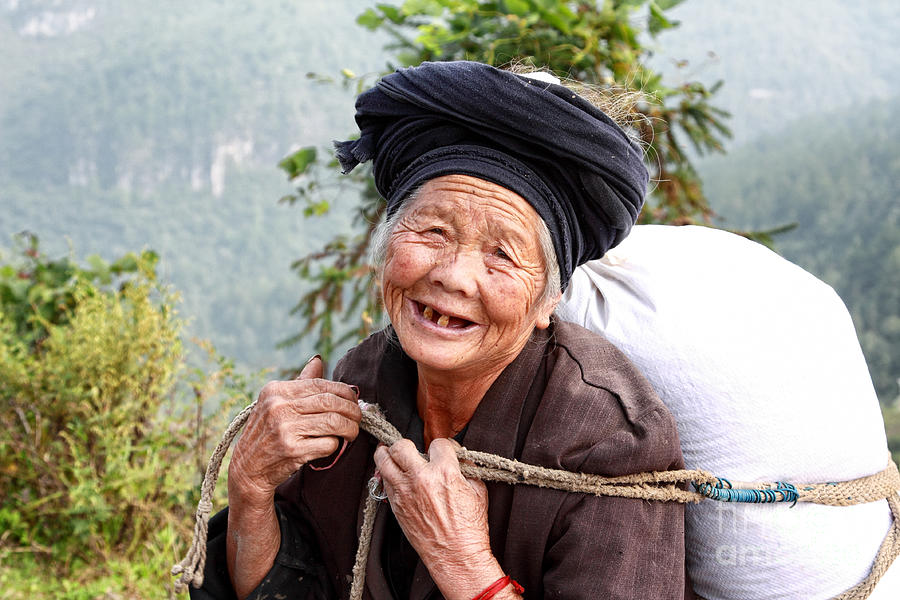 Elderly Miao Woman on Mountain Road Photograph by Charline Xia