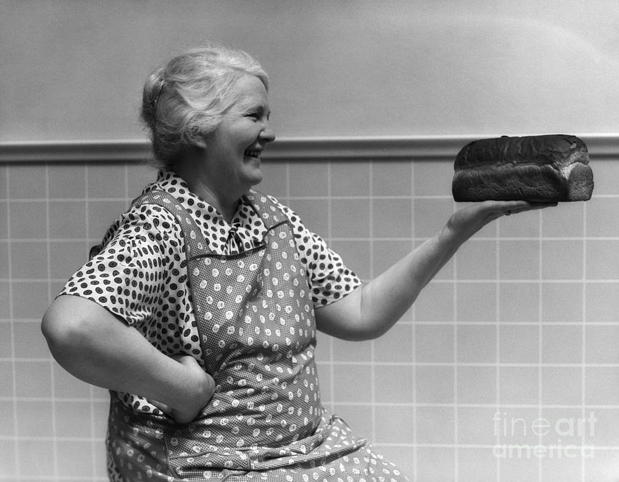 Elderly Woman Admiring Loaf Of Bread Photograph by H. Armstrong Roberts/ClassicStock