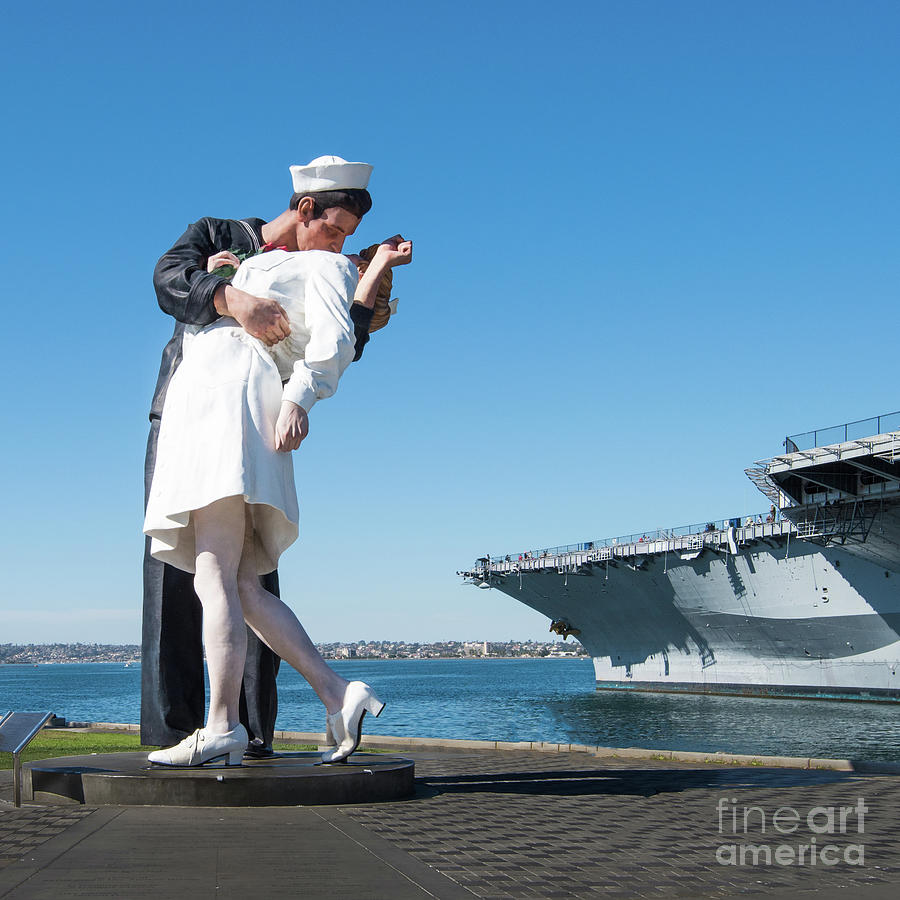 Embracing Peace Sculpture and USS Midway Aircraft Carrier Photograph by David Levin