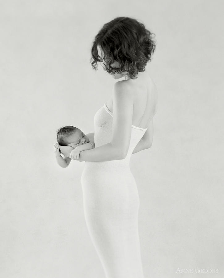 Black And White Photograph - Emily Holding Ella by Anne Geddes