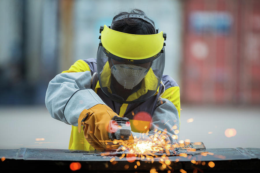 Employee Grinding Steel With Sparks Photograph By Anek Suwannaphoom Pixels