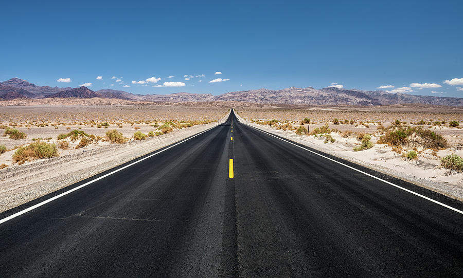 Empty Road Running Through Death Valley National Park Photograph By 