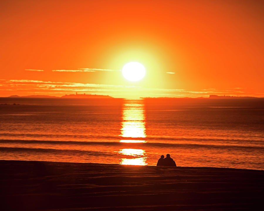 Enjoying the sunrise on Hampton Beach Hampton Beach NH Photograph by Toby McGuire