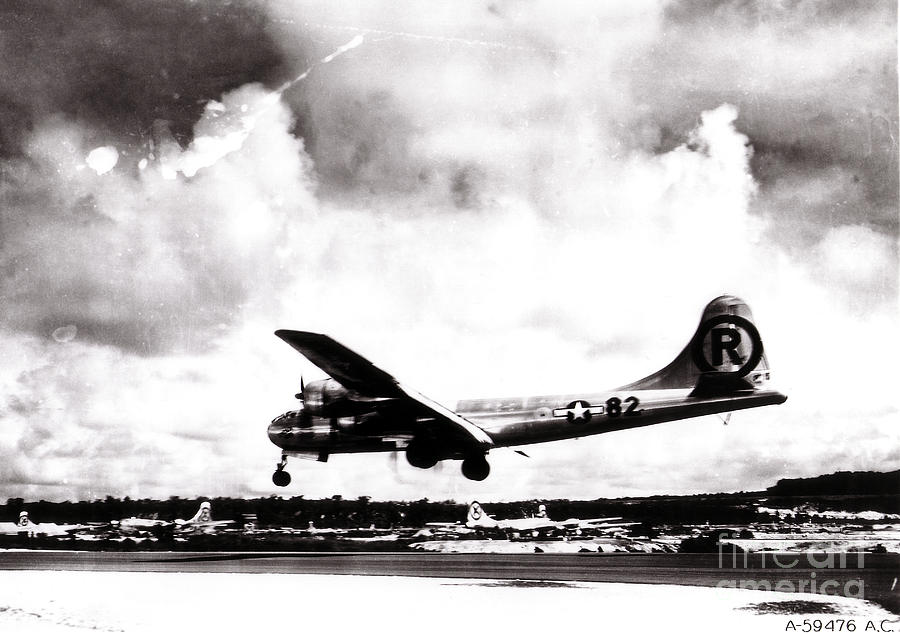 Airplane Photograph - Enola Gay Landing After Hiroshima by Photo Researchers