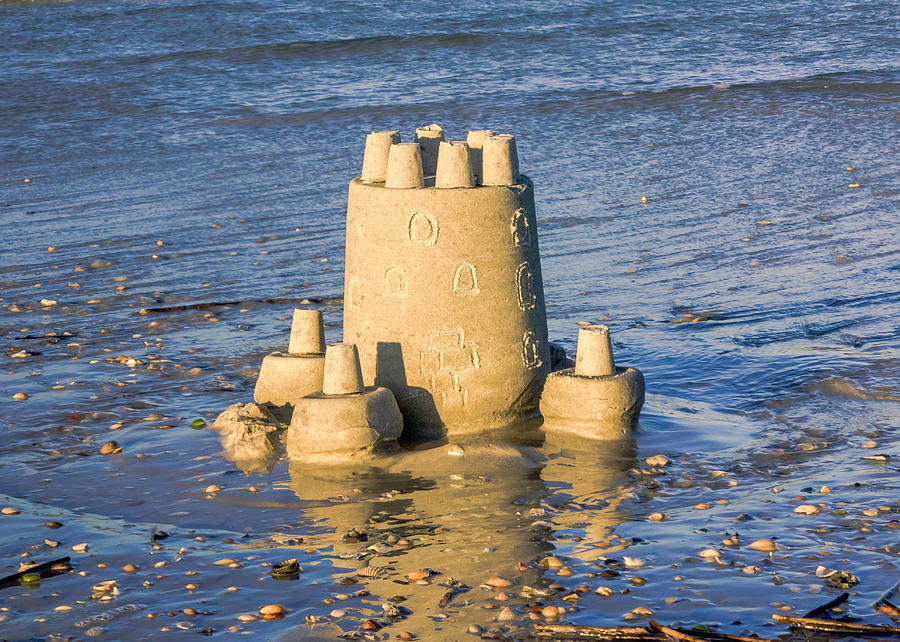 Eroding Sand Castle Photograph by Rob Sellers
