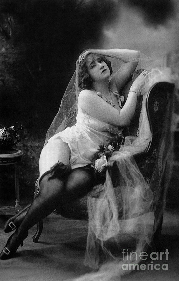 Erotic photo of a model wearing lingerie stockings and garters Photograph by French School