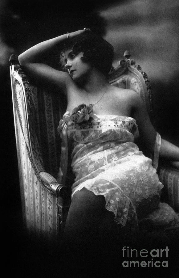 Erotic photo of a woman wearing lace lingerie in an armchair Photograph by French School