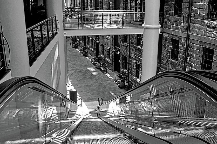 Black And White Photograph - Escalator Going Down in Sydney by Kirsten Giving