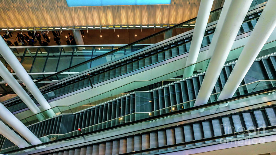 Escalators and columns in Munich airport Photograph by Claudia M Photography