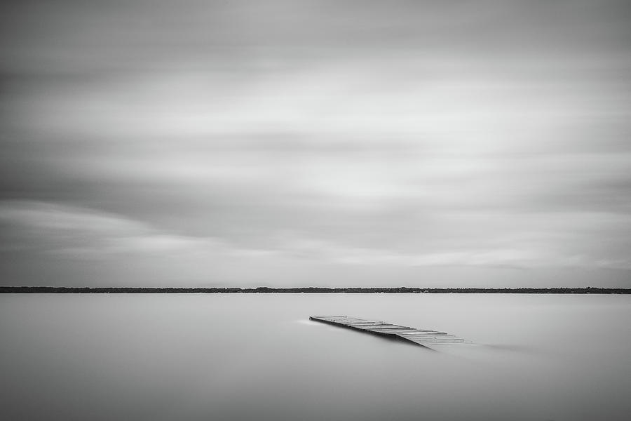 Ethereal Long Exposure Of A Pier In The Lake Photograph