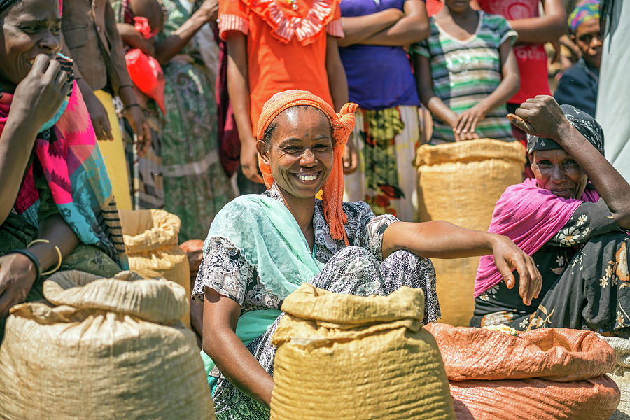 Ethiopian woman selling crops in a local crowded market Photograph by ...