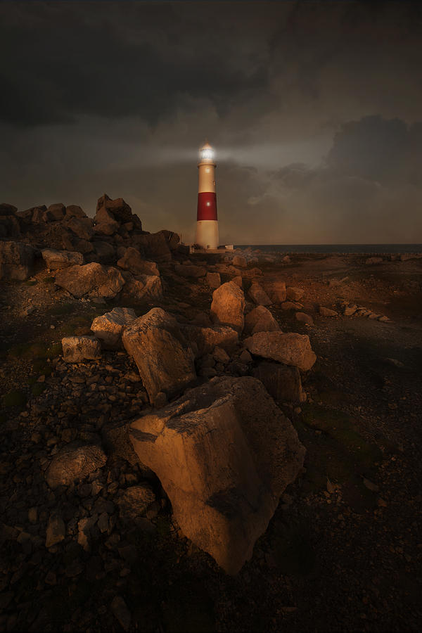 Evening coast with lighthouse Photograph by Jaroslaw Blaminsky