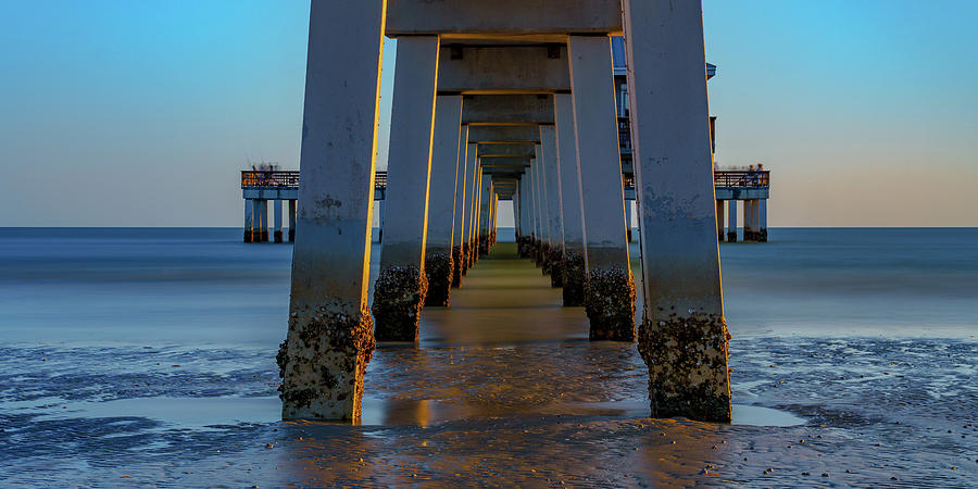 Evening Glow Beneath the Pier Photograph by Mark Rogers