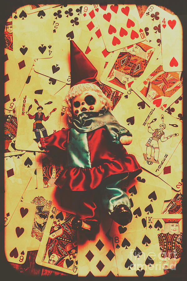 Evil clown doll on playing cards Photograph by Jorgo Photography