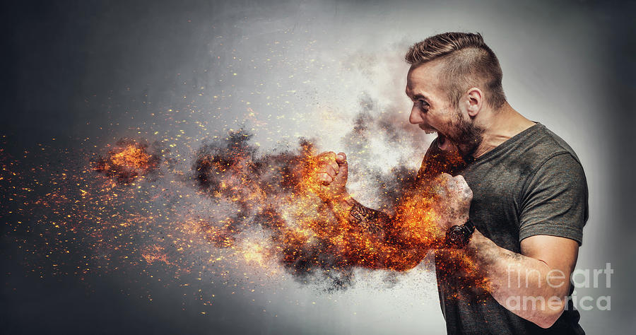 Excited man in fighting gesture with fists on fire. Photograph by Michal Bednarek