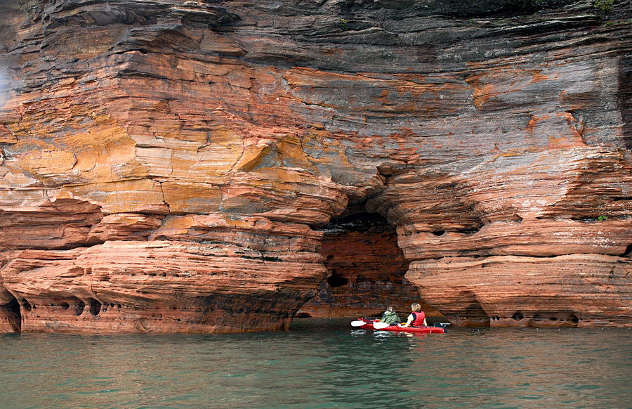 Exploring the Sea Caves Photograph by Larry Ricker