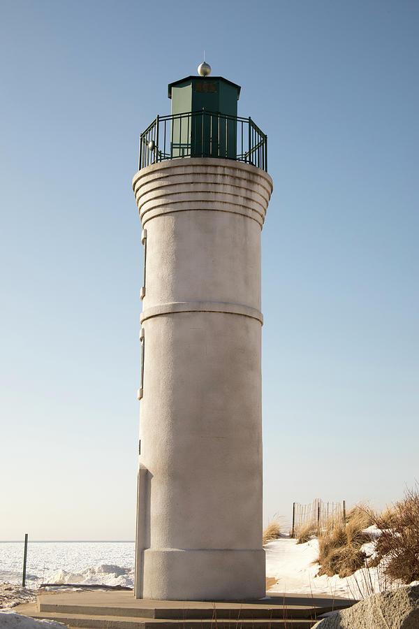 Exterior of Robert H Manning Lighthouse, Empire, Michigan in win Photograph by Karen Foley