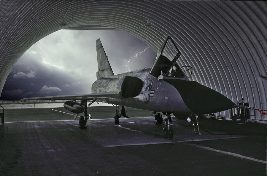 F-106 Waiting Out the Storm Photograph by Erik Simonsen