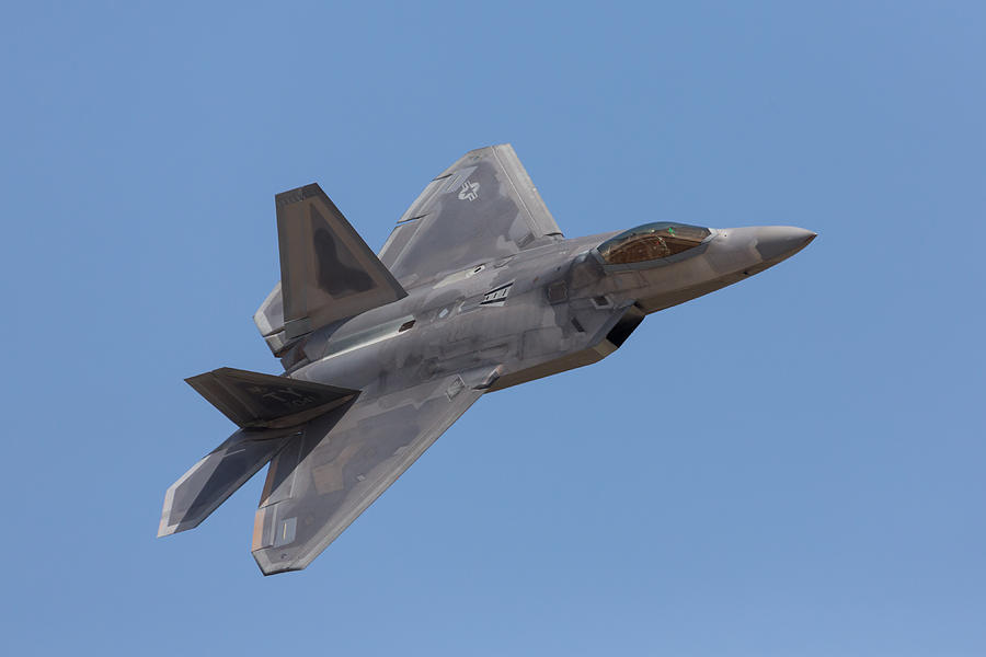 F-22 Raptor and Pilot Photograph by John Daly