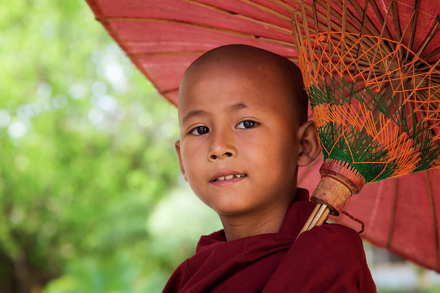 Face of myanmar monk with umbrella Photograph by Anek Suwannaphoom