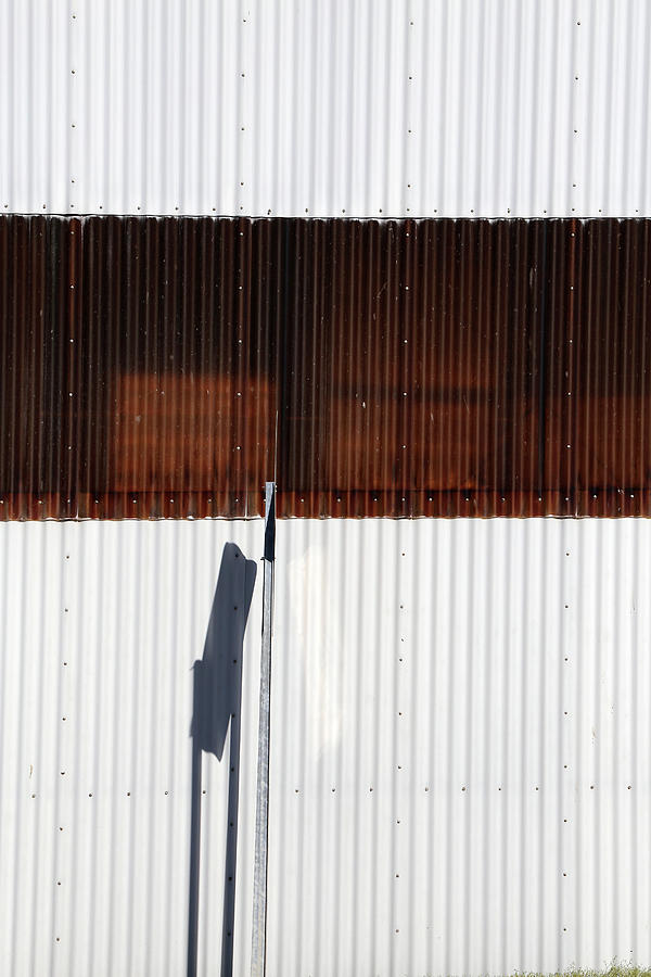 Factory Wall and Sign Shadow Photograph by Mary Bedy