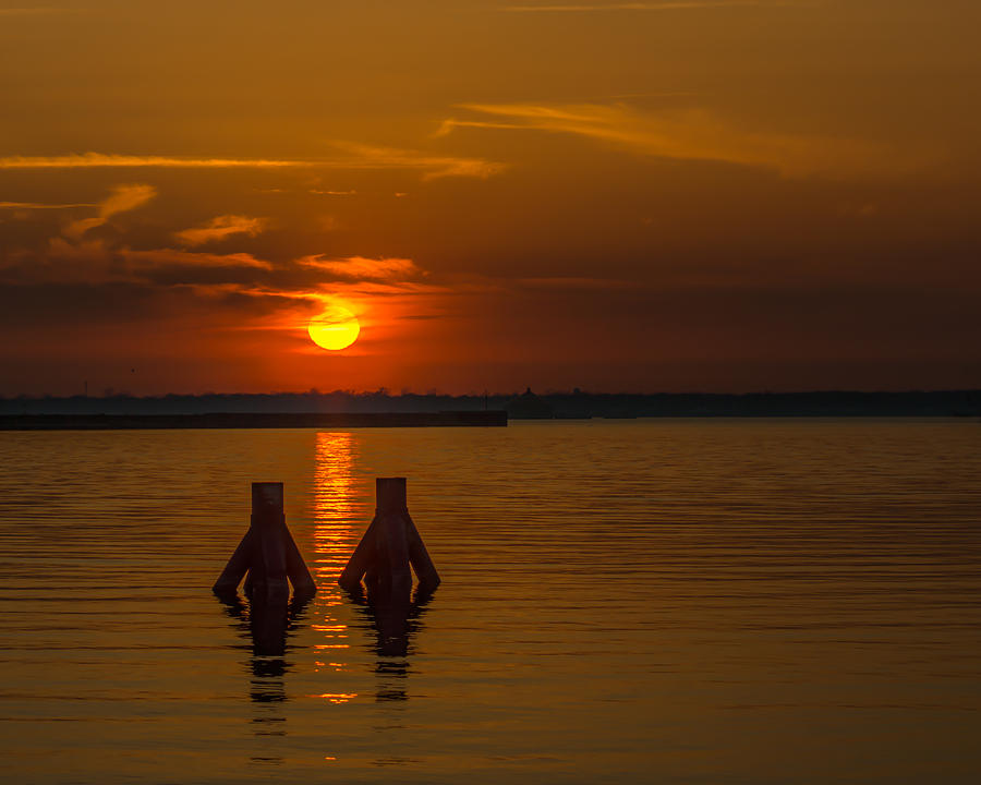 Falling sun on Buffalo Outer Harbor Photograph by Chris Bordeleau