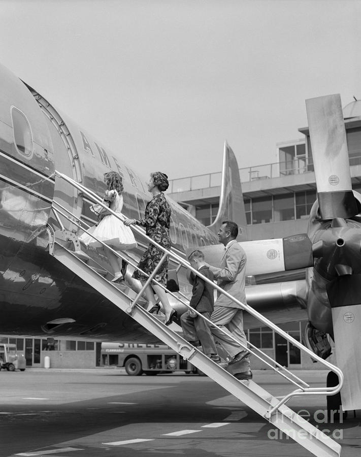 Family Boarding A Propeller Plane Photograph by H. Armstrong Roberts/ClassicStock