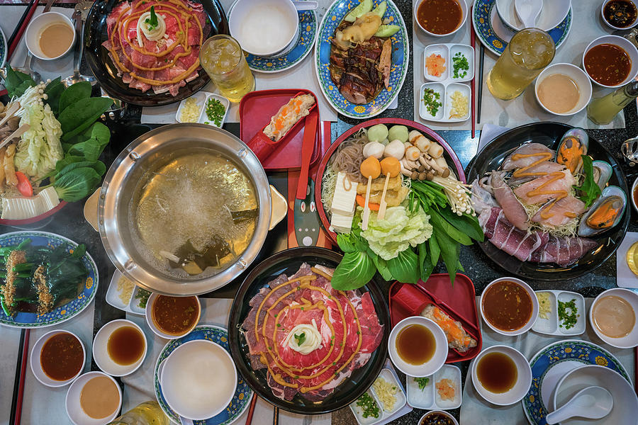 Family marty with sukiyaki seafood and beef shabu Photograph by Anek Suwannaphoom