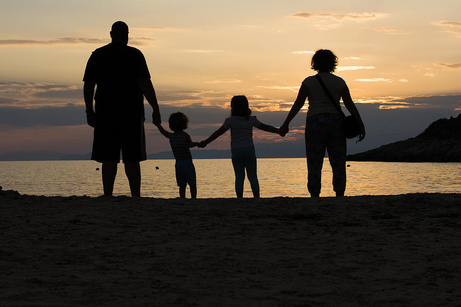 holding hands in the sunset