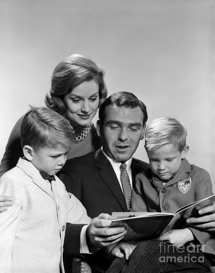 Family Reading A Book, C.1960s Photograph by H. Armstrong Roberts/ClassicStock