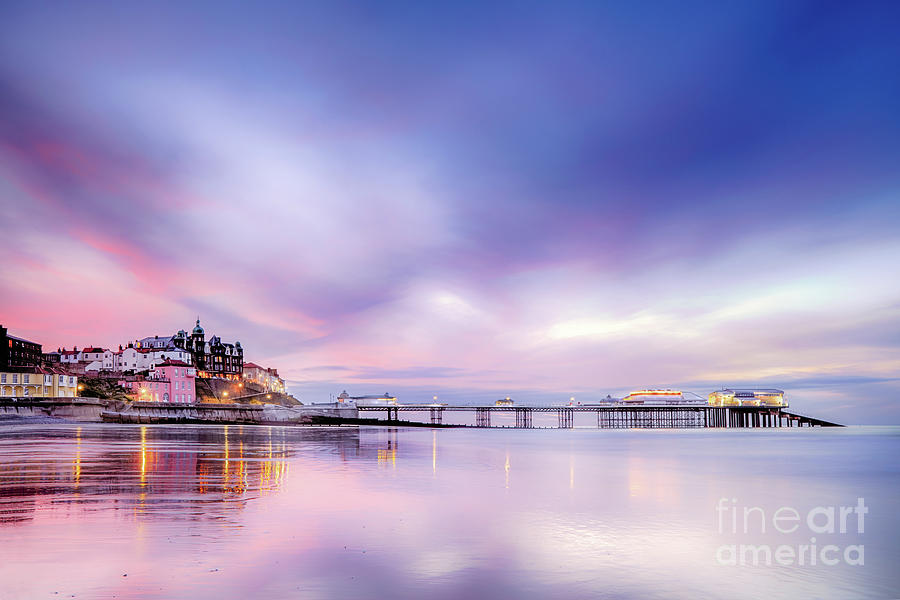 Famous Cromer pier in Norfolk England with pink sunset Photograph by Simon Bratt