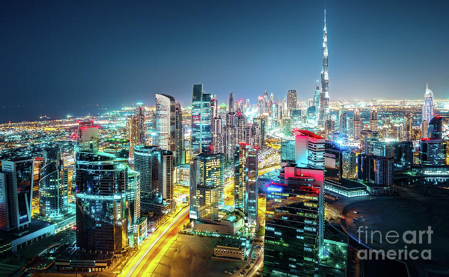 Skyscraper Photograph - Fantastic nightime skyline of Dubai, United Arab Emirates  by Dmitrii Telegin