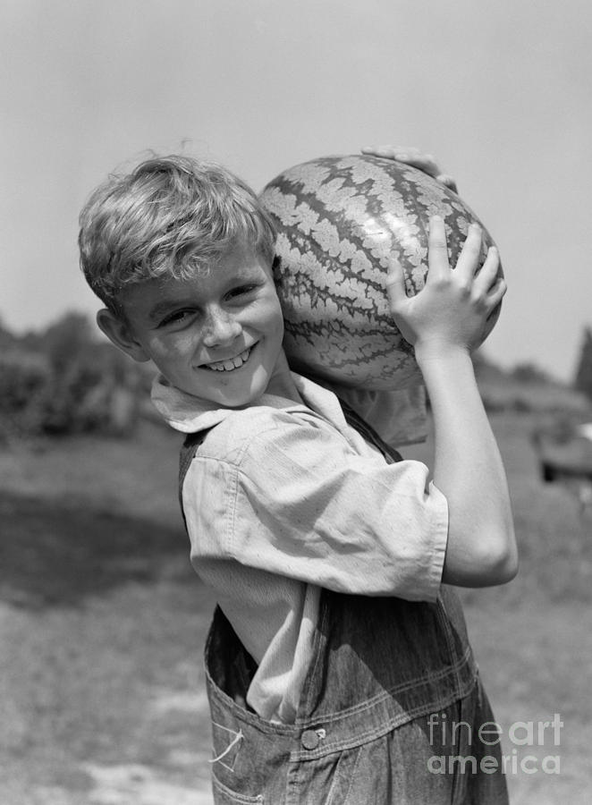 Farm Boy Carrying Watermelon, C.1930s Photograph by H. Armstrong Roberts/ClassicStock