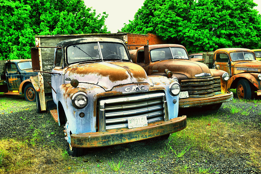 Farm relics Photograph by Jeff Swan