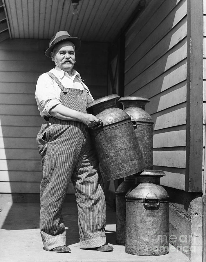 Farmer With Milk Canisters, C.1930s Photograph by H. Armstrong Roberts/ClassicStock