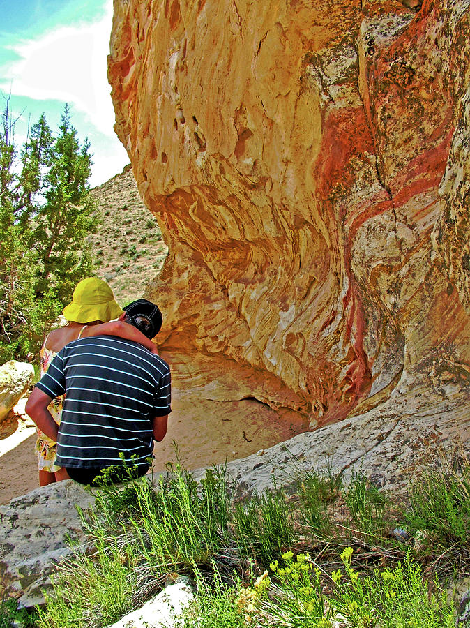 Father and Daughter by a Petroglyph Wall in Dinosaur National Monument, Utah  Photograph by Ruth Hager