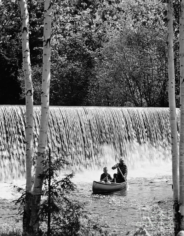Transportation Photograph - Father And Son Canoeing, C.1960-70s by H. Armstrong Roberts/ClassicStock