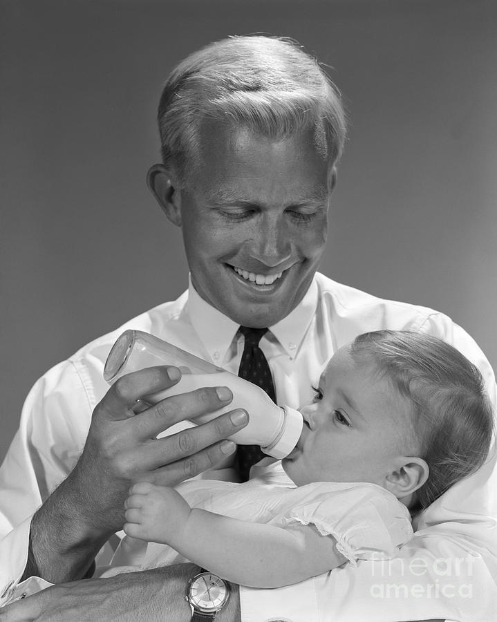 Father Bottle-feeding Baby, C.1960s Photograph by H. Armstrong Roberts/ClassicStock